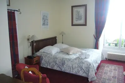 Un ou plusieurs lits dans un hébergement de l'établissement Logis Cote Loire - Auberge Ligerienne