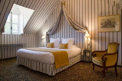 Un ou plusieurs lits dans un hébergement de l'établissement Hôtel du Domaine de La Groirie - Le Mans