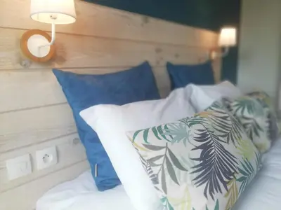 Un ou plusieurs lits dans un hébergement de l'établissement Logis Hotel Restaurant l'Orée Des Bois