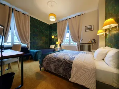 Un ou plusieurs lits dans un hébergement de l'établissement Hotel Mondial