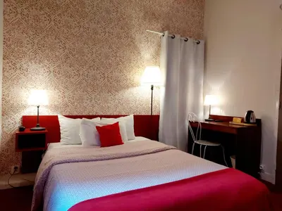 Un ou plusieurs lits dans un hébergement de l'établissement Hotel Mondial
