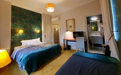 Un ou plusieurs lits dans un hébergement de l'établissement Hotel Mondial