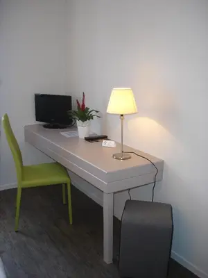 Télévision ou salle de divertissement dans l'établissement Hotel-Restaurant Du Lac