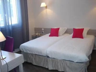Un ou plusieurs lits dans un hébergement de l'établissement Hotel-Restaurant Du Lac
