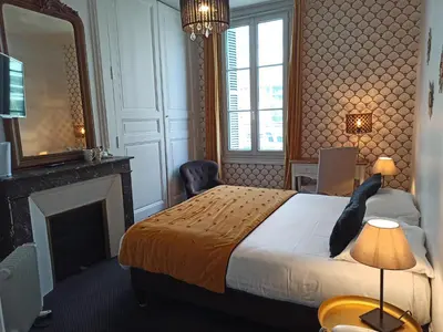 Un ou plusieurs lits dans un hébergement de l'établissement Hotel Val De Loire
