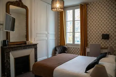 Un ou plusieurs lits dans un hébergement de l'établissement Hotel Val De Loire
