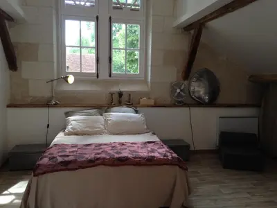 Un ou plusieurs lits dans un hébergement de l'établissement studio avec terrasse Abbaye d'Aiguevive