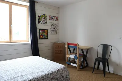 Un ou plusieurs lits dans un hébergement de l'établissement Maison ecologique en paille