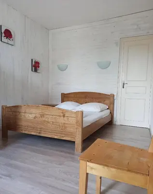 Un ou plusieurs lits dans un hébergement de l'établissement Gîte La P'tite Fugue