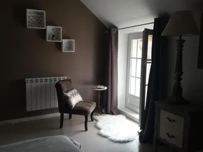 Un ou plusieurs lits dans un hébergement de l'établissement chambres des rosiers