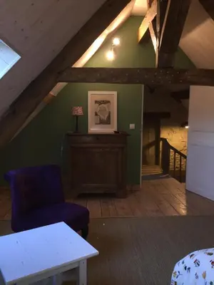 Coin salon dans l'établissement Le Moulin du Bourg