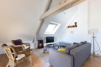 Coin salon dans l'établissement Appartement des Grands Champs avec terrasse