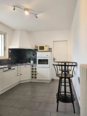 Cuisine ou kitchenette dans l'établissement Appartement des Grands Champs avec terrasse