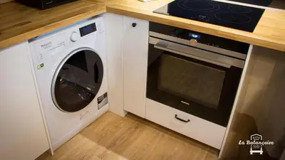 Cuisine ou kitchenette dans l'établissement La balançoire