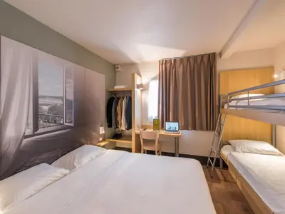 Un ou plusieurs lits dans un hébergement de l'établissement B&B HOTEL Blois Sud Vineuil