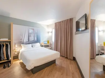 Un ou plusieurs lits dans un hébergement de l'établissement B&B HOTEL Blois Sud Vineuil