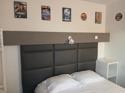 Un ou plusieurs lits dans un hébergement de l'établissement hôtel QUICK Palace Tours Nord