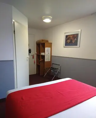 Un ou plusieurs lits dans un hébergement de l'établissement Quick Palace Le Mans
