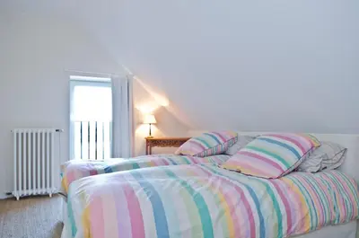 Un ou plusieurs lits dans un hébergement de l'établissement Maison Melrose