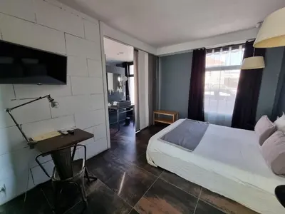 Un ou plusieurs lits dans un hébergement de l'établissement Maison d'hôtes Villa Richelieu
