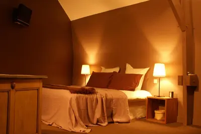 Un ou plusieurs lits dans un hébergement de l'établissement Maison d'hôtes Villa Richelieu