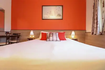 Un ou plusieurs lits dans un hébergement de l'établissement ACE Hôtel Travel Athée sur Cher - A85 Aire du Val de Cher
