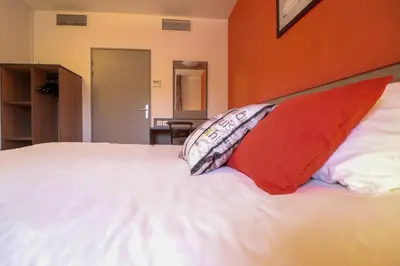 Un ou plusieurs lits dans un hébergement de l'établissement ACE Hôtel Travel Athée sur Cher - A85 Aire du Val de Cher