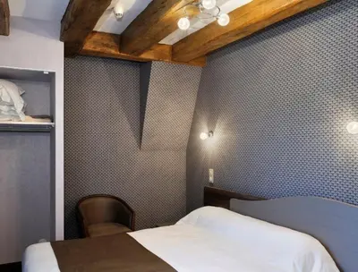 Un ou plusieurs lits dans un hébergement de l'établissement Hôtel Auberge de la Bonde logis