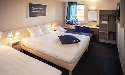 Un ou plusieurs lits dans un hébergement de l'établissement Ace Hôtel Le Mans