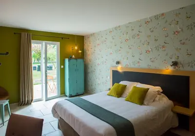Un ou plusieurs lits dans un hébergement de l'établissement Auberge Pom'Poire