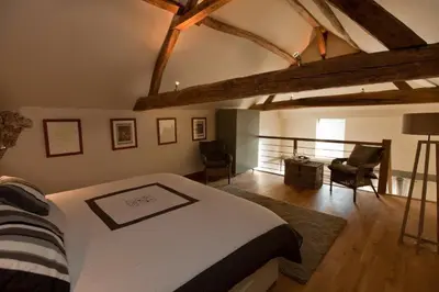 Un ou plusieurs lits dans un hébergement de l'établissement Gite La Suite Ducale Chateau La Roche Racan