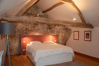 Un ou plusieurs lits dans un hébergement de l'établissement Gite La Suite Ducale Chateau La Roche Racan