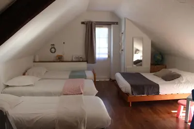 Un ou plusieurs lits dans un hébergement de l'établissement Les gîtes du Hameau des deux ailes