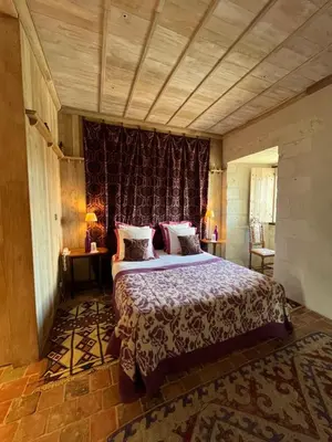 Un ou plusieurs lits dans un hébergement de l'établissement Hôtel du Château du Rivau