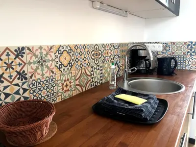 Cuisine ou kitchenette dans l'établissement L'Arbre
