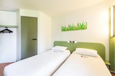 Un ou plusieurs lits dans un hébergement de l'établissement ibis budget Châtellerault Nord