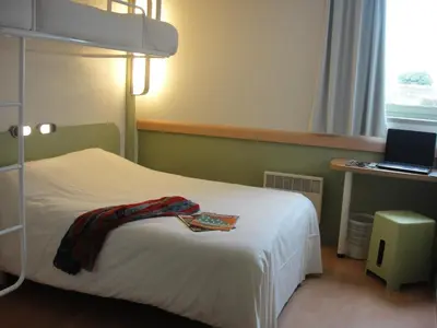 Un ou plusieurs lits dans un hébergement de l'établissement ibis budget Châtellerault Nord
