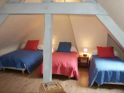 Un ou plusieurs lits dans un hébergement de l'établissement Gîte familial confortable dans un ancien moulin avec jardin - FR-1-381-6
