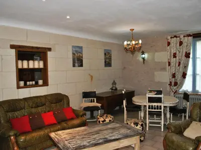 Coin salon dans l'établissement Gîte familial confortable dans un ancien moulin avec jardin - FR-1-381-6