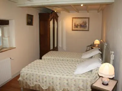Un ou plusieurs lits dans un hébergement de l'établissement Gîte familial confortable dans un ancien moulin avec jardin - FR-1-381-6