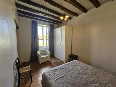 Un ou plusieurs lits dans un hébergement de l'établissement Charmante maison de campagne dans une ferme rénovée - FR-1-381-262