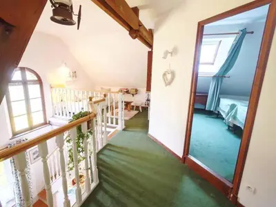 Un ou plusieurs lits dans un hébergement de l'établissement Gîte confortable avec parc boisé, activités familiales et équipements modernes près de la Loire - FR-1-381-470