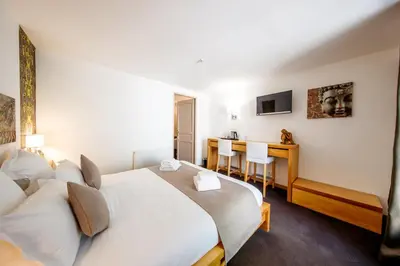 Un ou plusieurs lits dans un hébergement de l'établissement Domaine de Presle Saumur, The Originals Relais