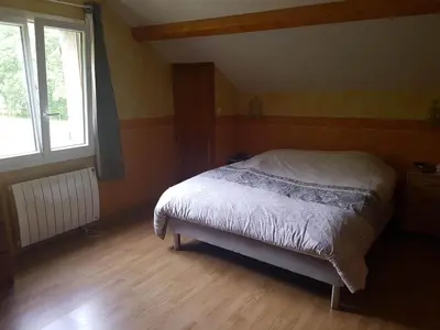 Un ou plusieurs lits dans un hébergement de l'établissement Maison 6 chambres au cœur du circuit des 24h du Mans