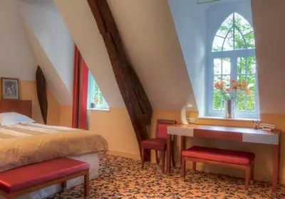Un ou plusieurs lits dans un hébergement de l'établissement Maison d'hôtes Le Manoir de Contres