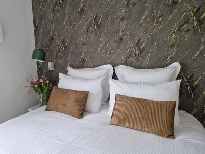 Un ou plusieurs lits dans un hébergement de l'établissement Chambre d'hôtes