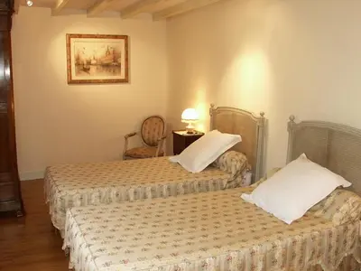 Un ou plusieurs lits dans un hébergement de l'établissement Séjour Authentique dans un Ancien Moulin - Gîte Confort avec Jardin Privatif - FR-1-381-475