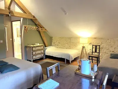 Un ou plusieurs lits dans un hébergement de l'établissement Chambres d'Hôtes La Vallée des Vignes