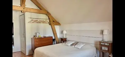 Un ou plusieurs lits dans un hébergement de l'établissement Chambres d'Hôtes La Vallée des Vignes