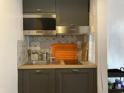 Cuisine ou kitchenette dans l'établissement Blanqui Loft